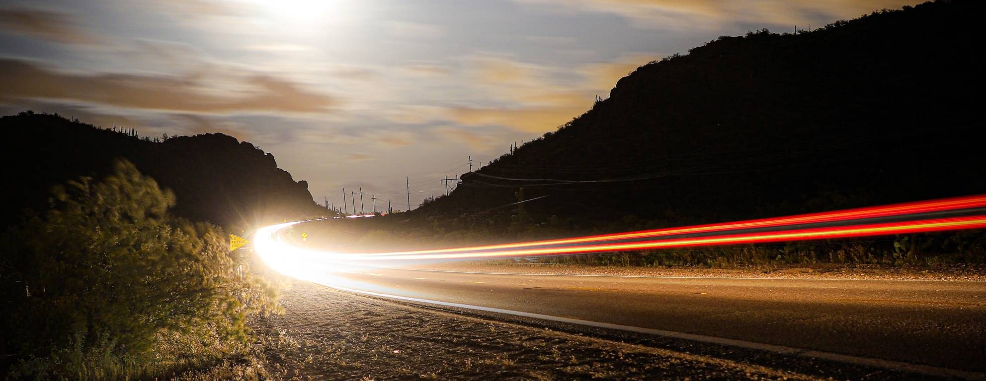 A photo of a highway with cars going fast on it